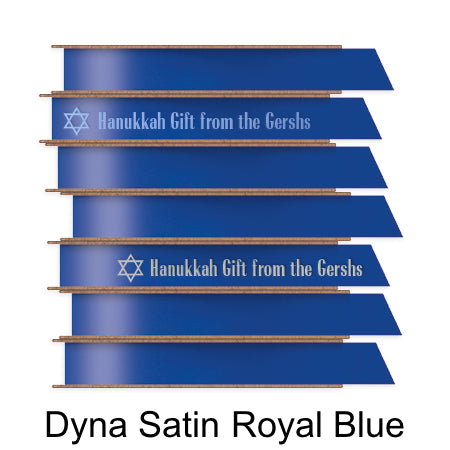 A stack of seven spools of shiny royal blue satin ribbon with custom messages printed on them in different colors.