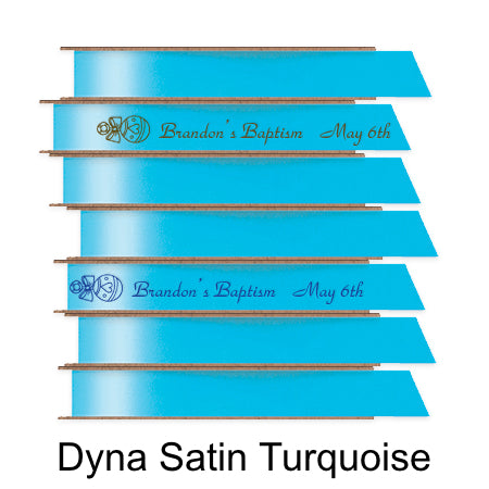 A stack of seven spools of shiny turquoise aqua satin ribbon with custom messages printed on them in different colors.