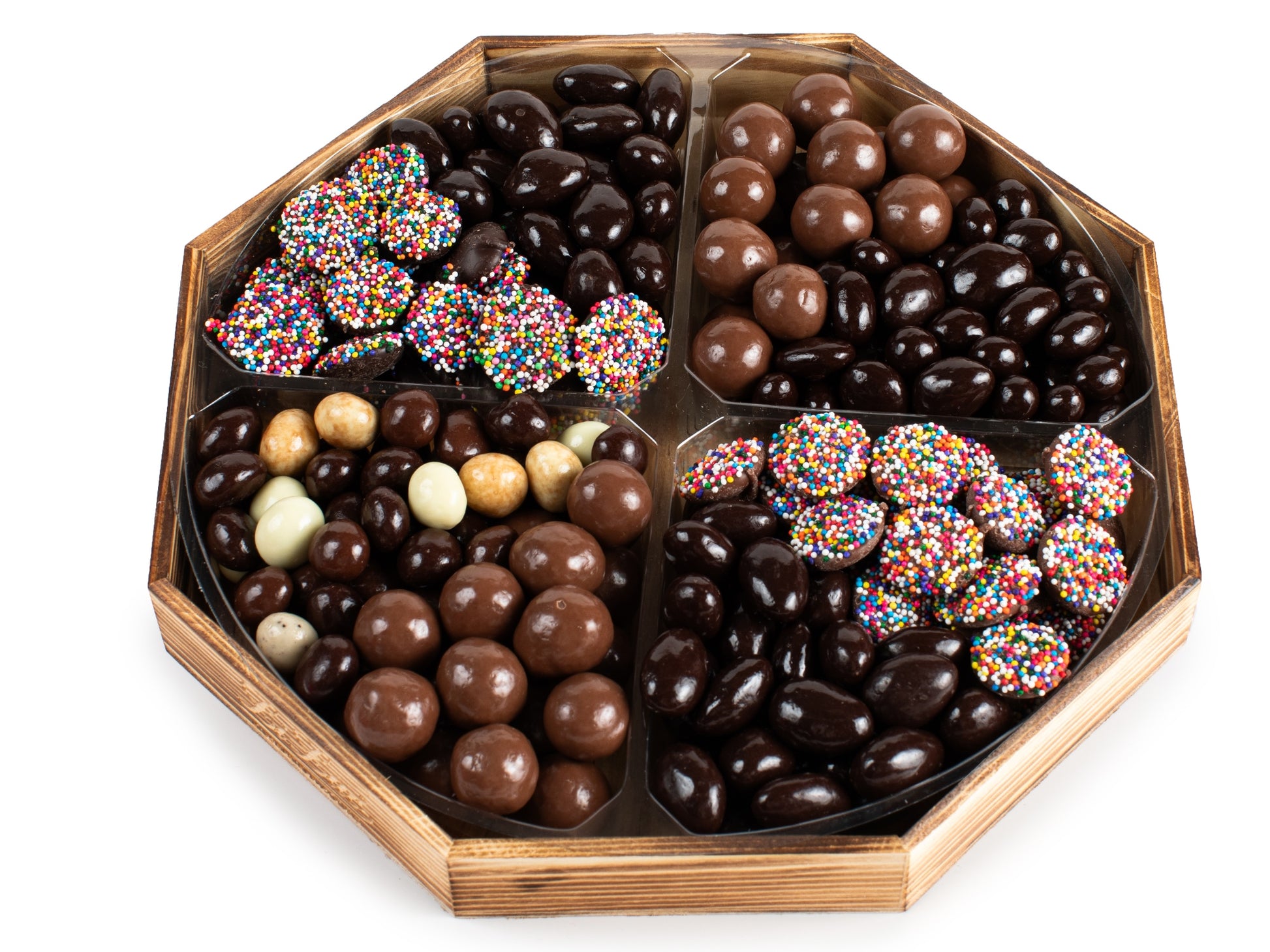 Malt balls, chocolate covered almonds, espresso mix and nonpareils are artfully placed on a platter.