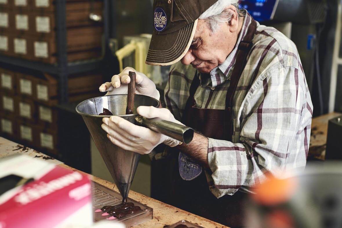 A chocolatier making chocolate