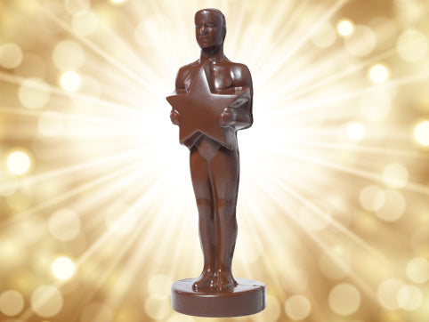 A molded chocolate Achievement Award, it's a man standing tall holding a star.