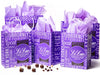 Handled gift bags in two sizes are assembled together. The bags feature the purple Li-Lac Chocolate logo and text branding all over, and have lilac purple tissue paper inside. 