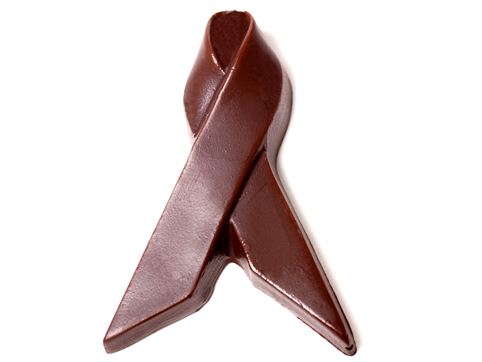 A three-dimensional chocolate ribbon molded in a loop to represent an awareness ribbon.