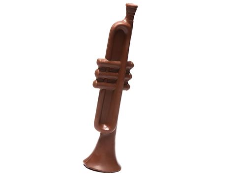 A three-dimensional chocolate molded trumpet.