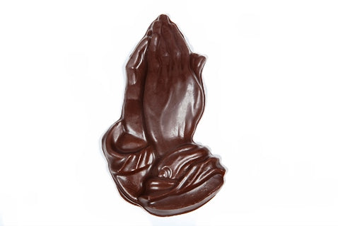 Three-dimensional chocolate molded praying hands