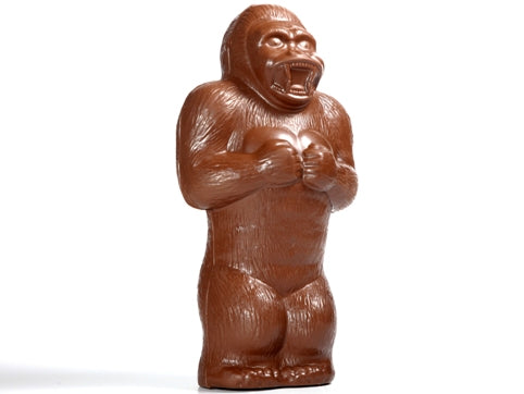 Giant molded chocolate King Kong style gorilla. He beats his chest with a wide mouth growl.